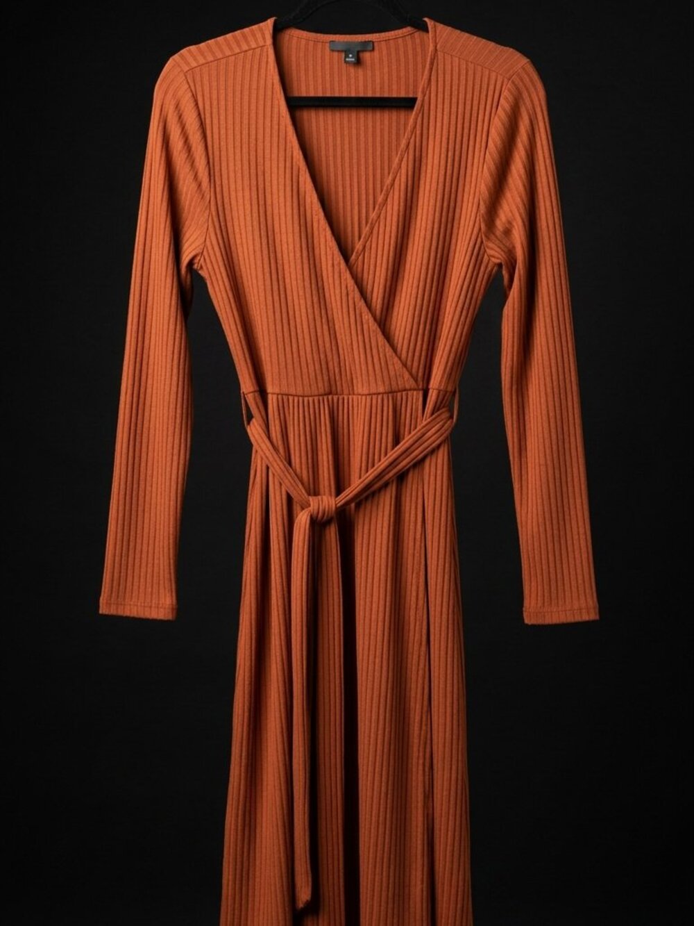A rust-colored wrap dress
